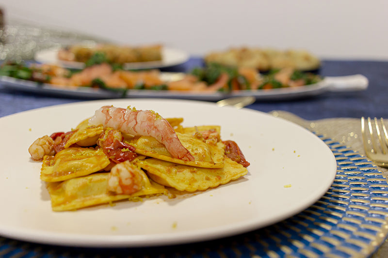 Ravioli di cernia con ragù di gamberoni e scorza di limone
